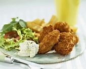 Chicken nuggets with chips and salad