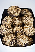 Chocolate balls with pine nuts