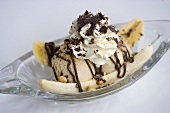 Banana split with vanilla ice cream and cream