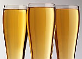 Three glasses of cider in a row