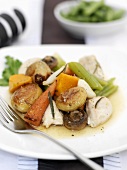 Cooked chicken with vegetables and rosemary