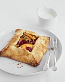 Peach and raspberry pie with pistachios