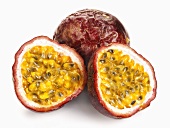 Whole and halved passion fruit