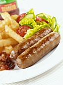 Sausage and chips with salad