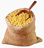 Elbow pasta in jute sack with scoop