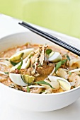 Seafood laksa with boiled egg (Singapore)