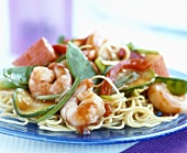 Prawns and vegetables on pasta
