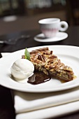 Pecan pie with a scoop of ice cream