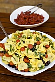 Ravioli salad with tomatoes and olives