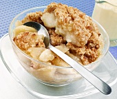 Apple crumble in a glass bowl