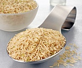 Brown basmati rice on a spoon and in a bowl