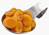 Dried apricots on a spoon