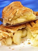 Puff pastry apple pie, one piece on server