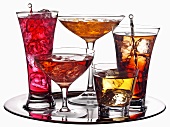 Various coloured cocktails on a tray