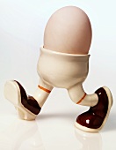 A boiled egg in an eggcup with legs