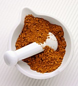 Curry powder in a mortar with pestle