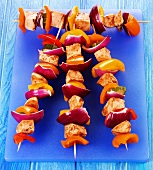 Four grilled chicken and vegetable kebabs