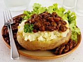 A baked potato with chili con carne