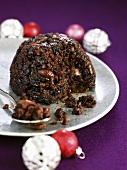 British Christmas pudding with Christmas baubles