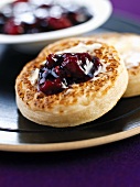 Crumpets with butter and jam (UK)