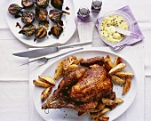 Paprika chicken with potato wedges and caper aioli
