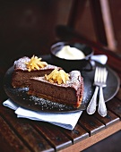 Two pieces of chocolate cheesecake with crystallised ginger