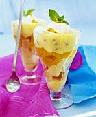 Peach and passion fruit trifle in two glasses