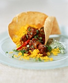 Spicy lamb curry with saffron rice and poppadom