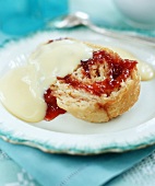 Yeast pastry with jam and vanilla sauce