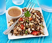 Rice salad with lentils and aubergines, garlic dressing