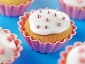 Cupcakes with icing and dragées