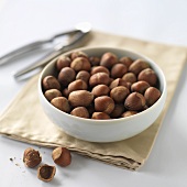 Whole hazelnuts in ceramic bowl