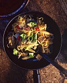 Egg fried noodles with vegetables and tofu