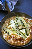 Courgette omelette in a frying pan