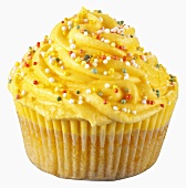 Cupcake with yellow cream and sprinkles