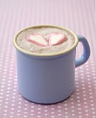 Hot chocolate with two marshmallow hearts