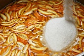 Making orange marmalade: adding the sugar