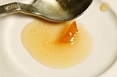 Orange marmalade on a plate with spoon