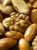 Walnuts and almonds with honey (close-up)