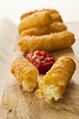 Deep-fried cheese and onion croquettes in beer batter