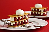 Raspberry dessert with crisp wafers and vanilla ice cream