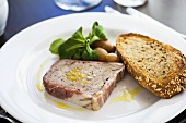 Duck pâté with toast and pearl onions