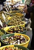 Various types of olives on a market stall