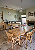 Kitchen with wooden furniture and stone floor