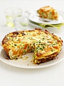 Vegetable frittata, a piece removed
