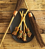 Witches' broomsticks made from savoury sticks (Halloween)