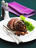 Bacon-wrapped pigeon with savoy cabbage