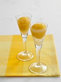 Peach sorbet in two sparkling wine glasses