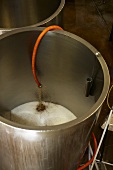 Beer running into a stainless steel tank