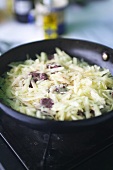 Grated potato in a frying pan